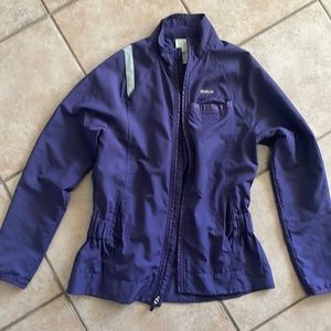 Reebok running jacket.Excellent condition.Dark purple, silver reflector strips.